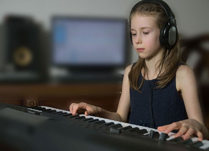 child learning piano